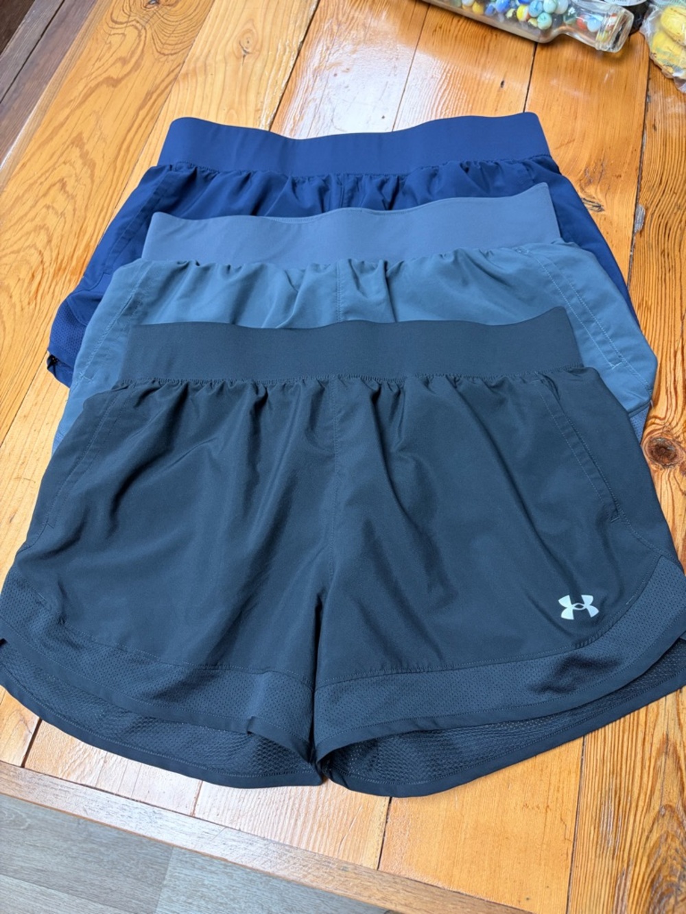 3 pairs Under Armour Women's Black Blue and Gray Performance Running Shorts